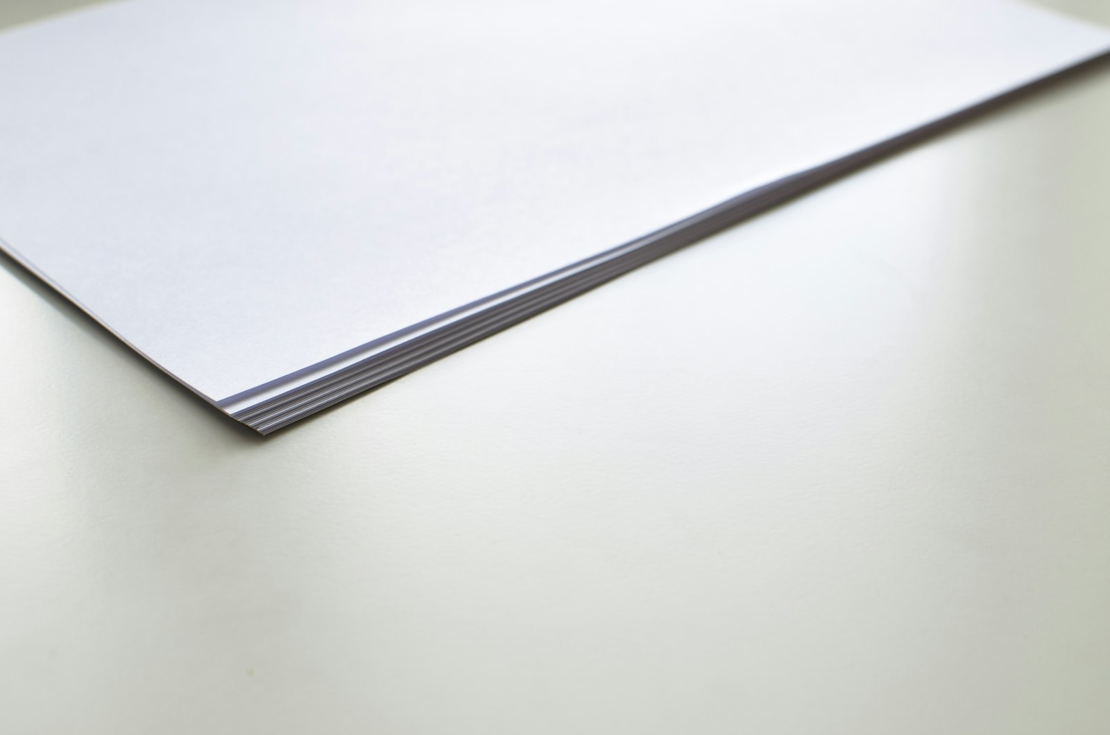 White office paper stacked on a desk